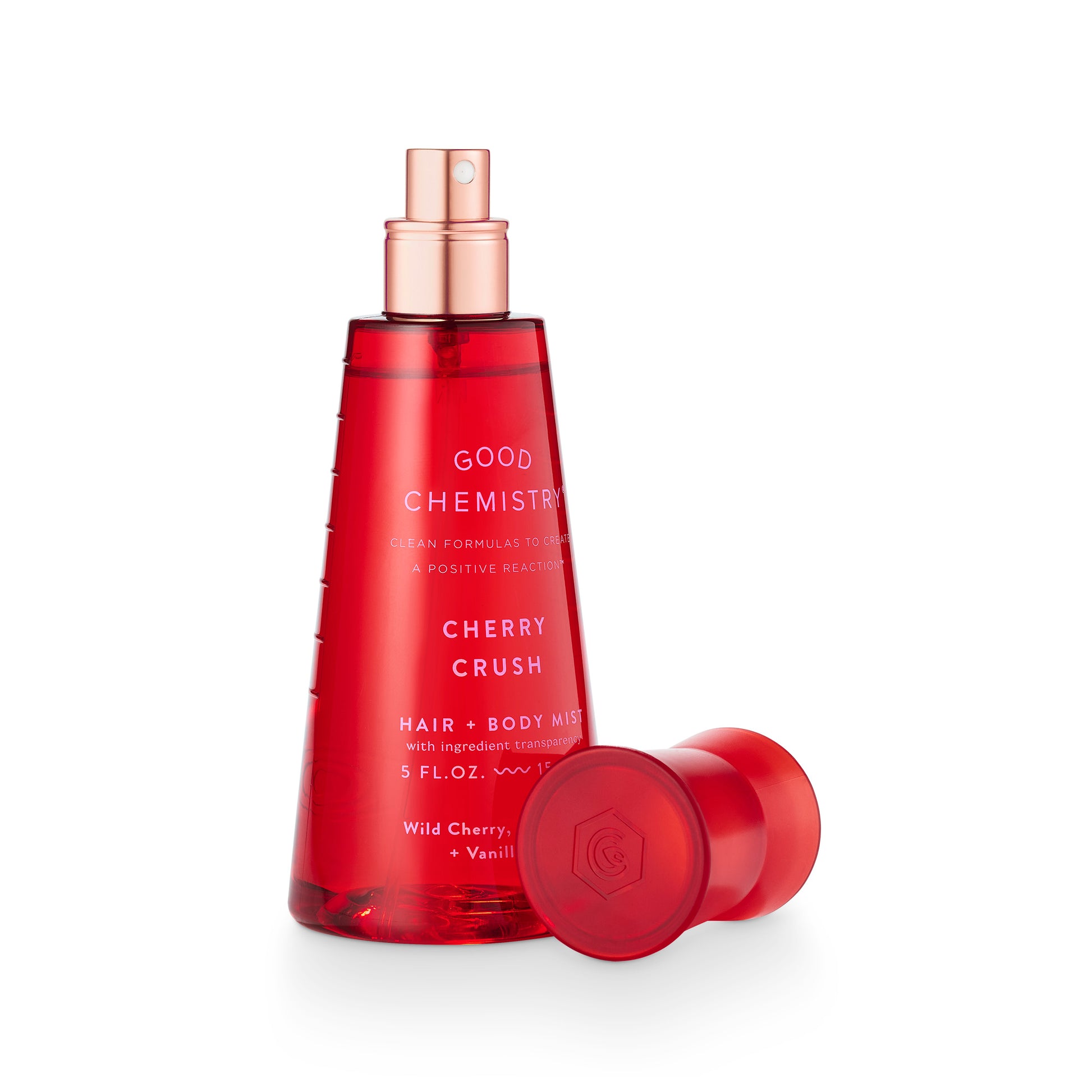 Red bottle of Good Chemistry Cherry Crush hair and body mist on a white background facing right