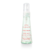 Good Chemistry Pink Palm body mist bottle on a white background
