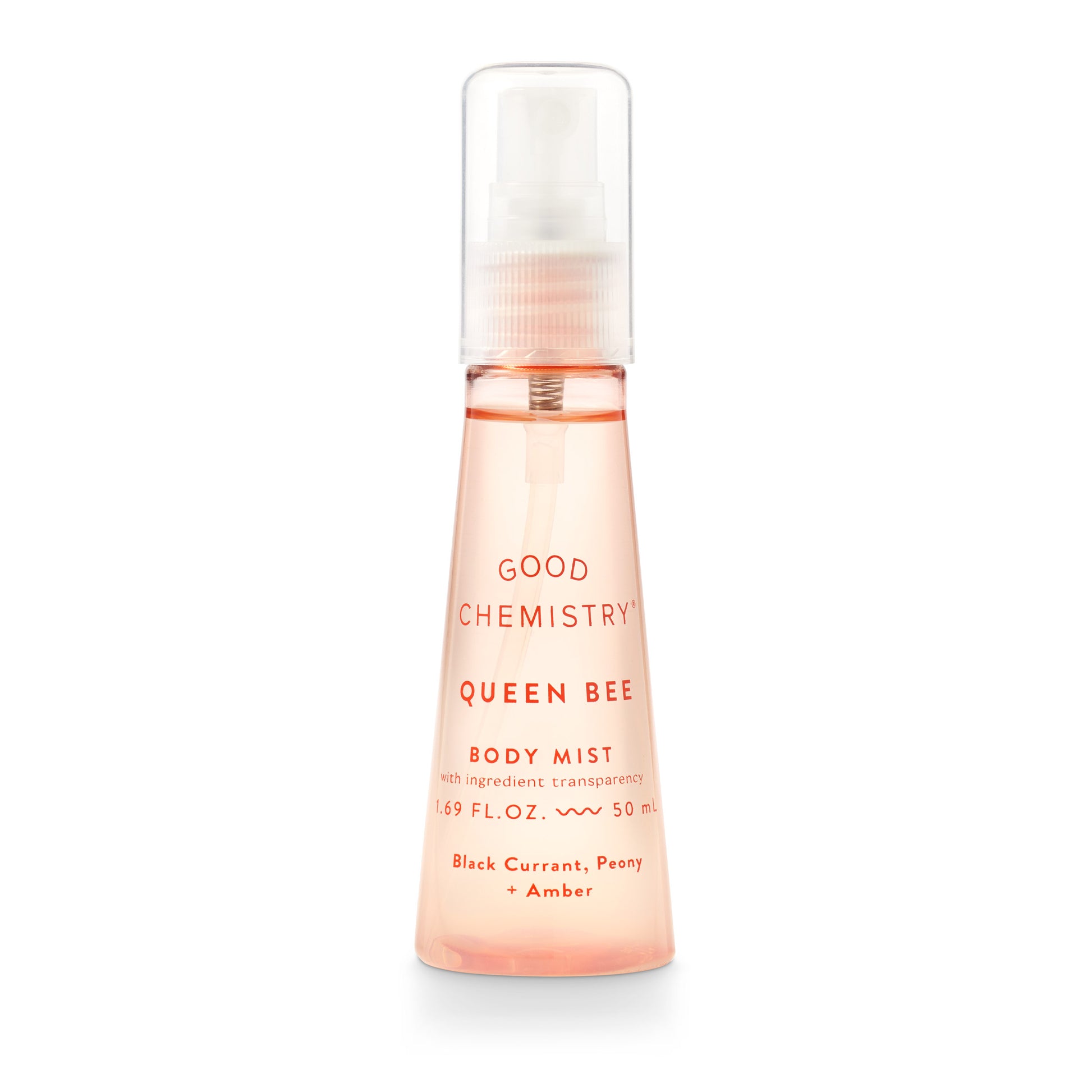 A pink spray bottle labeled 'GOOD CHEMISTRY Queen Bee Body Mist' with text indicating fragrance notes of black currant, peony, and amber.