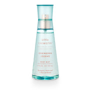A clear spray bottle labeled 'GOOD CHEMISTRY UNKNOWN LEGEND BODY MIST' with a blue cap and translucent blue liquid visible inside.