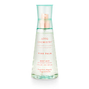 A clear spray bottle labeled 'GOOD CHEMISTRY PINK PALM BODY MIST' with a pink and green color scheme on the label.
