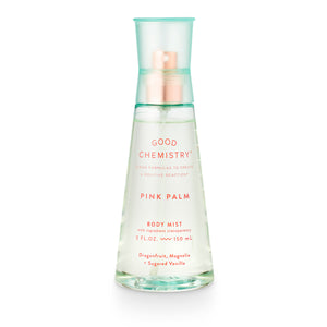 A clear spray bottle labeled 'GOOD CHEMISTRY PINK PALM BODY MIST' with a pink and green color scheme on the label.